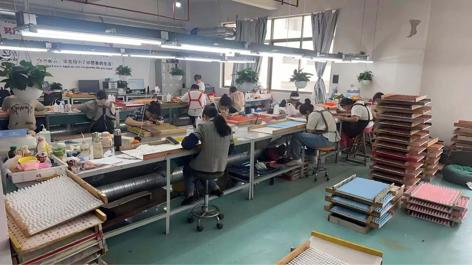Production workshop with staff at work tables