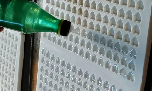 Material being applied to production molds