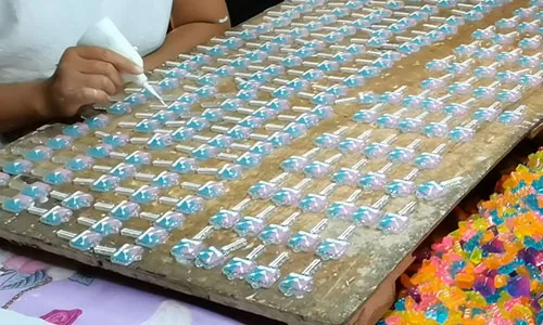 Hand-painted resin pieces on a production board